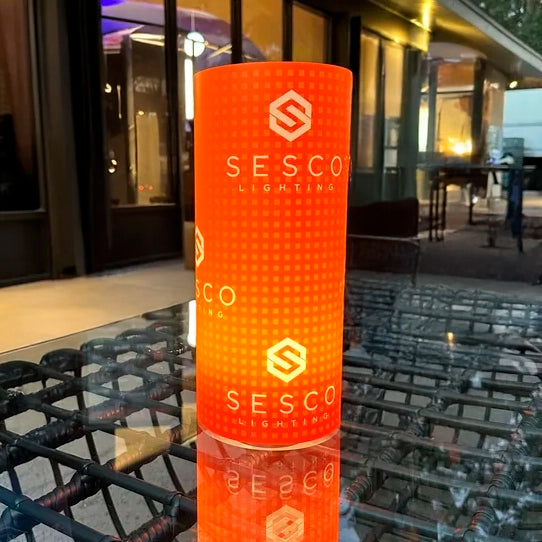 Branded illuminated centerpiece with custom company logo for corporate event