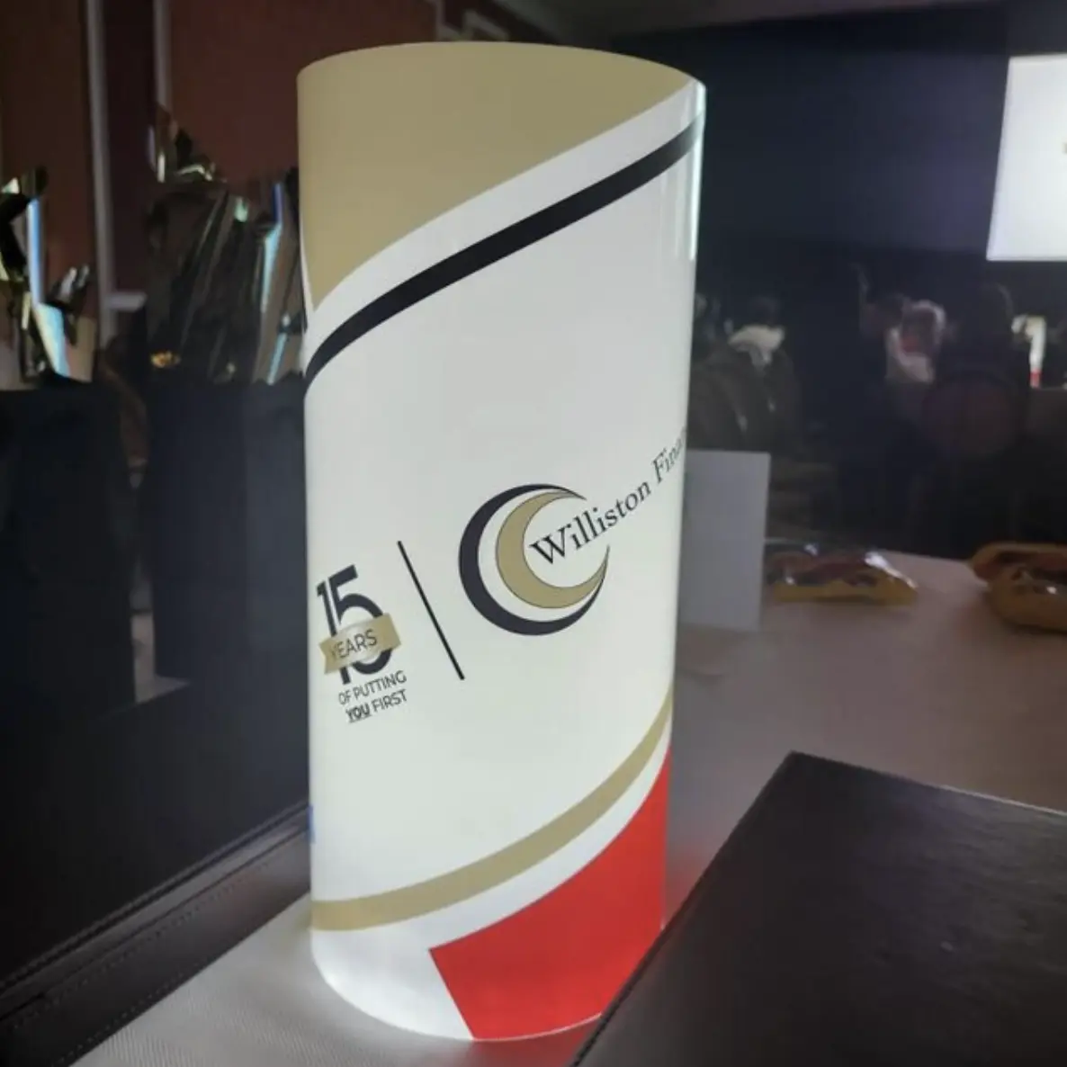 A gold and blue illuminated centerpiece created for a corporate anniversary