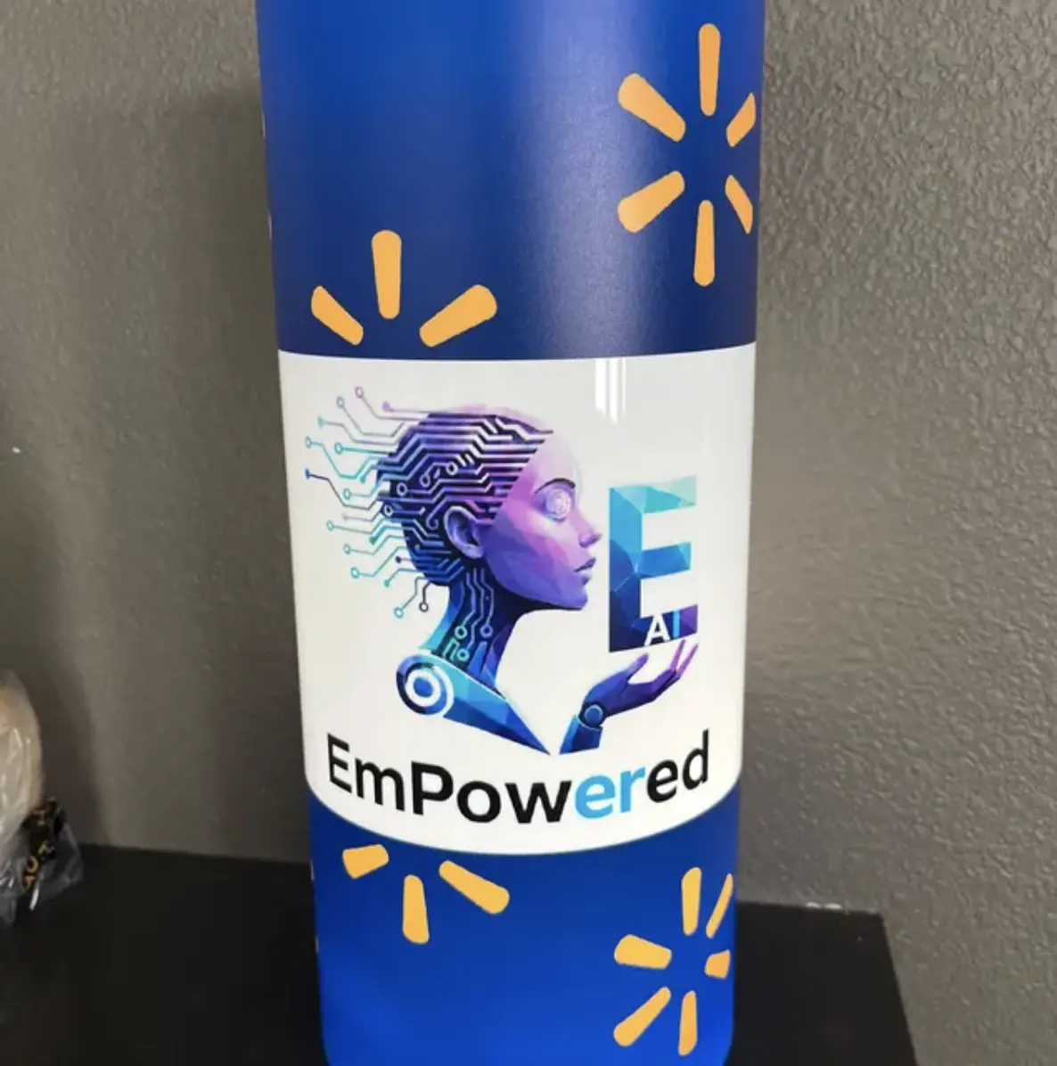 A purple and blue illuminated centerpiece with an employee empowerment message