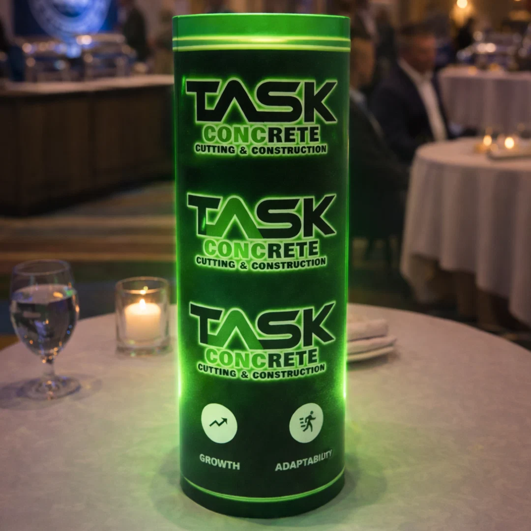 Green branded illuminated centerpiece on an event table