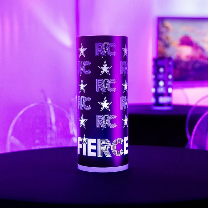 Purple lighted centerpiece glowing on an event table