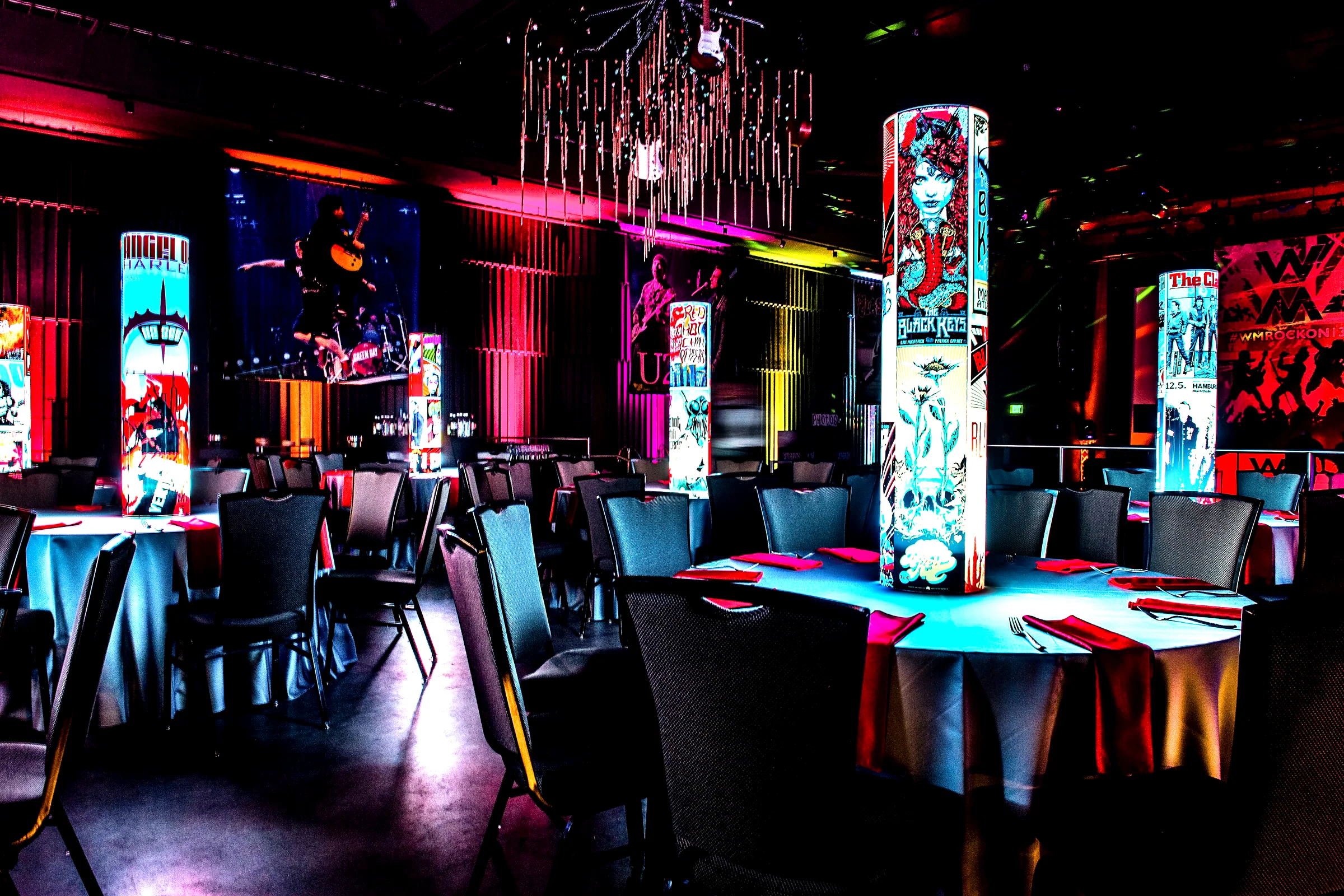 Rock-and-roll themed illuminated centerpieces transforming a Bar Mitzvah room