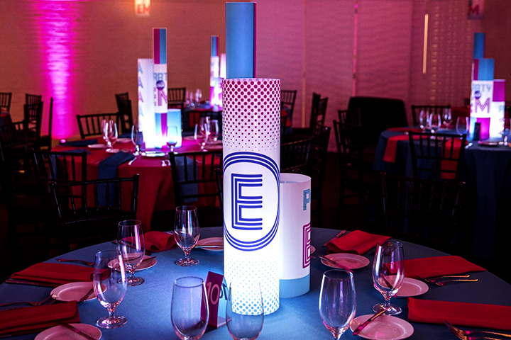 Custom Mitzvah centerpieces in a ballroom