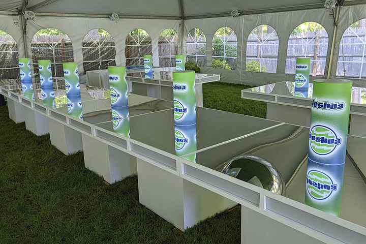 Custom illuminated centerpieces in a tented event